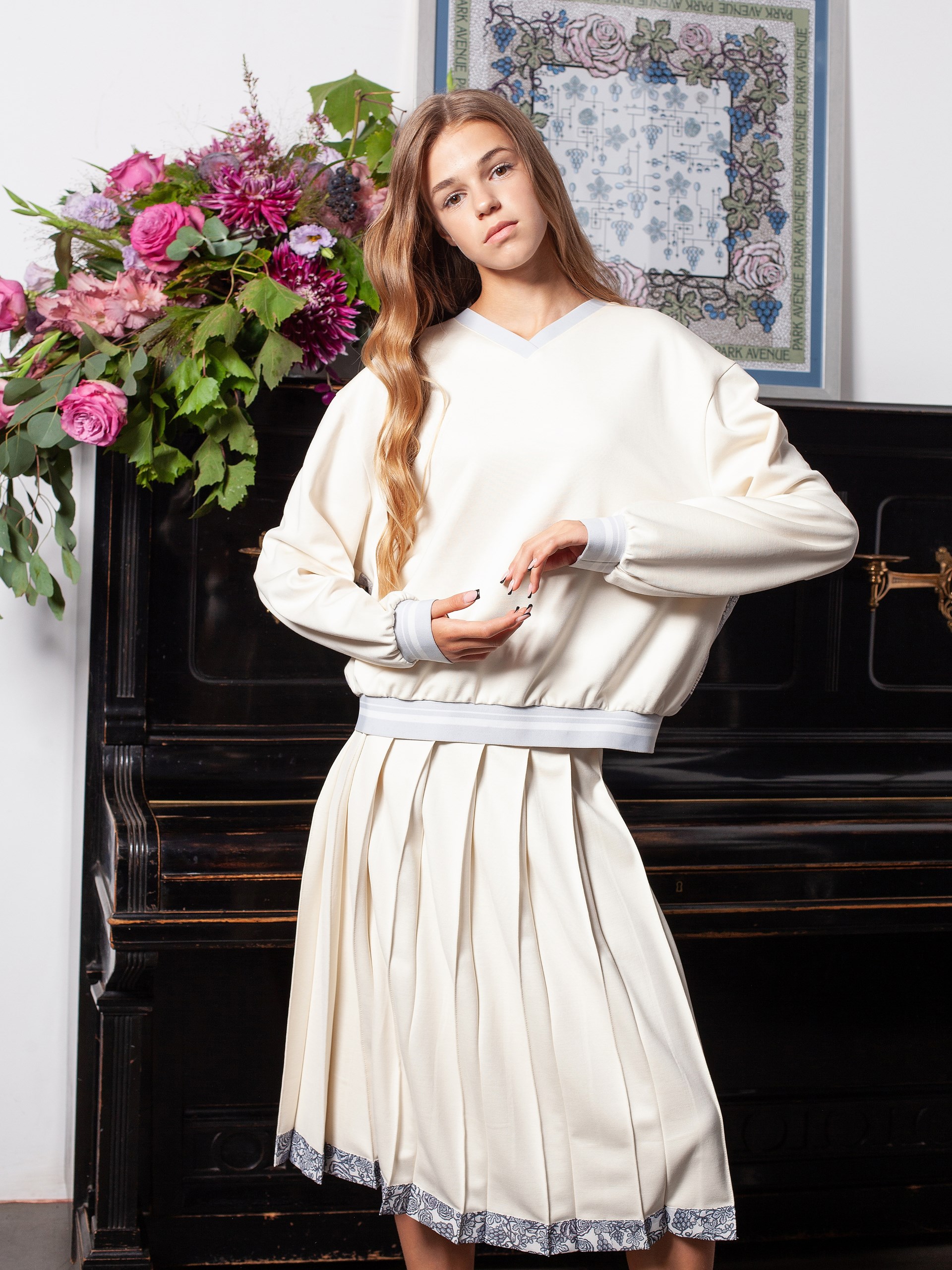 Park Avenue Atelier ivory sweater with signature print on the back