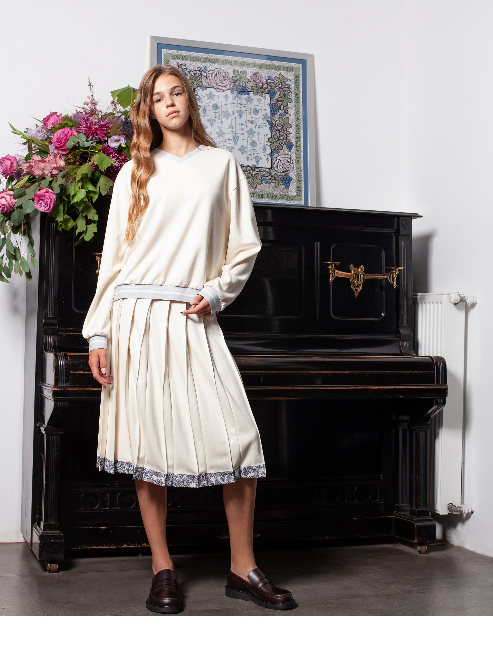 Park Avenue Atelier ivory sweater with signature print on the back
