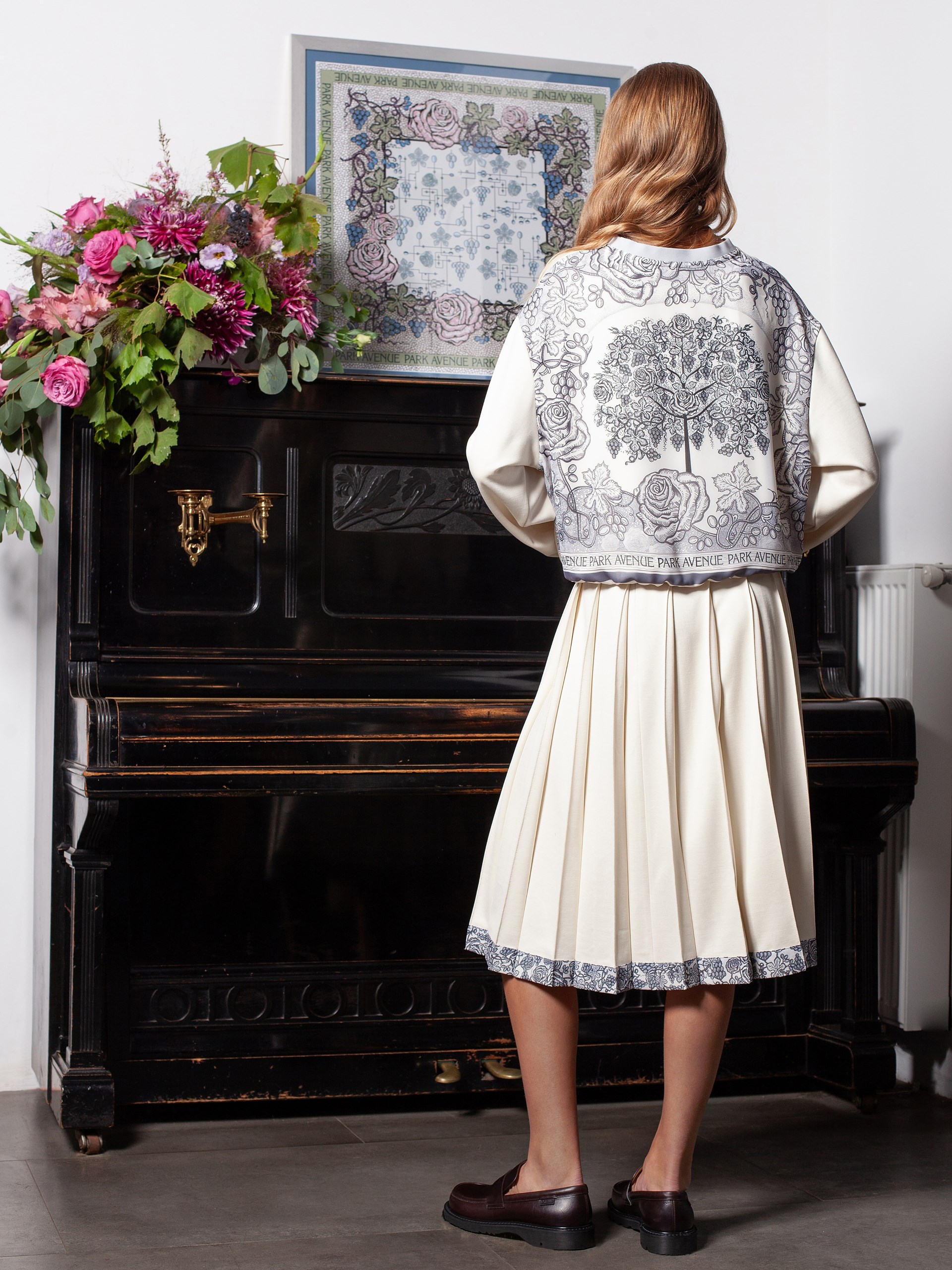 Park Avenue Atelier ivory sweater with signature print on the back