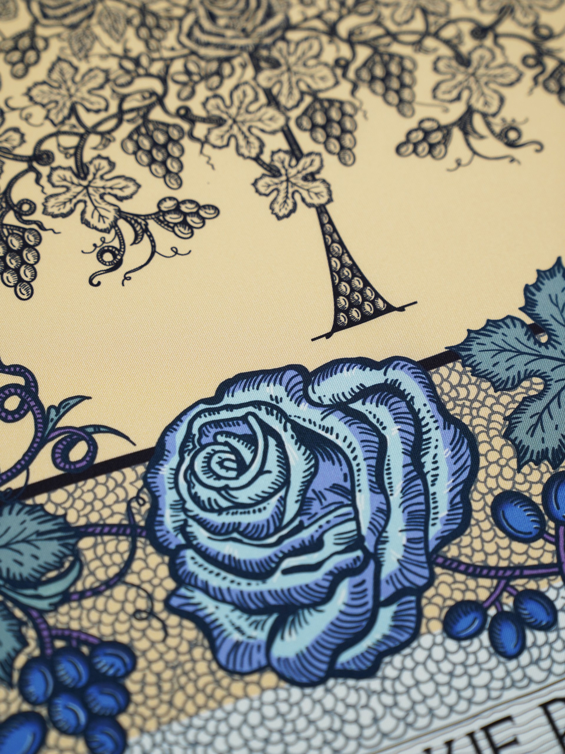 Park Avenue Atelier navy blue scarf on a beige background with an author's print