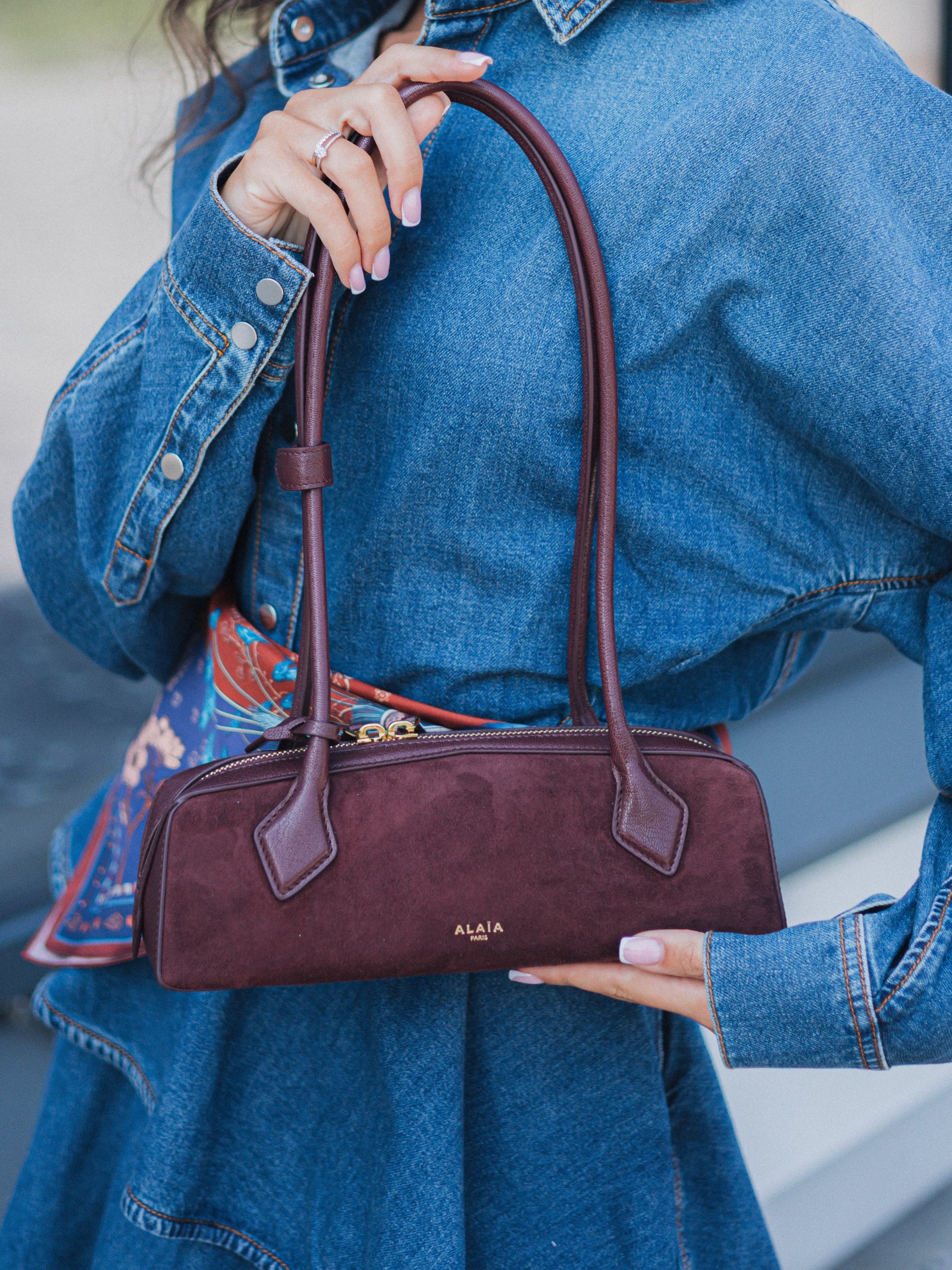 Alaia Le Teckel elongated garnet-red leather bag
