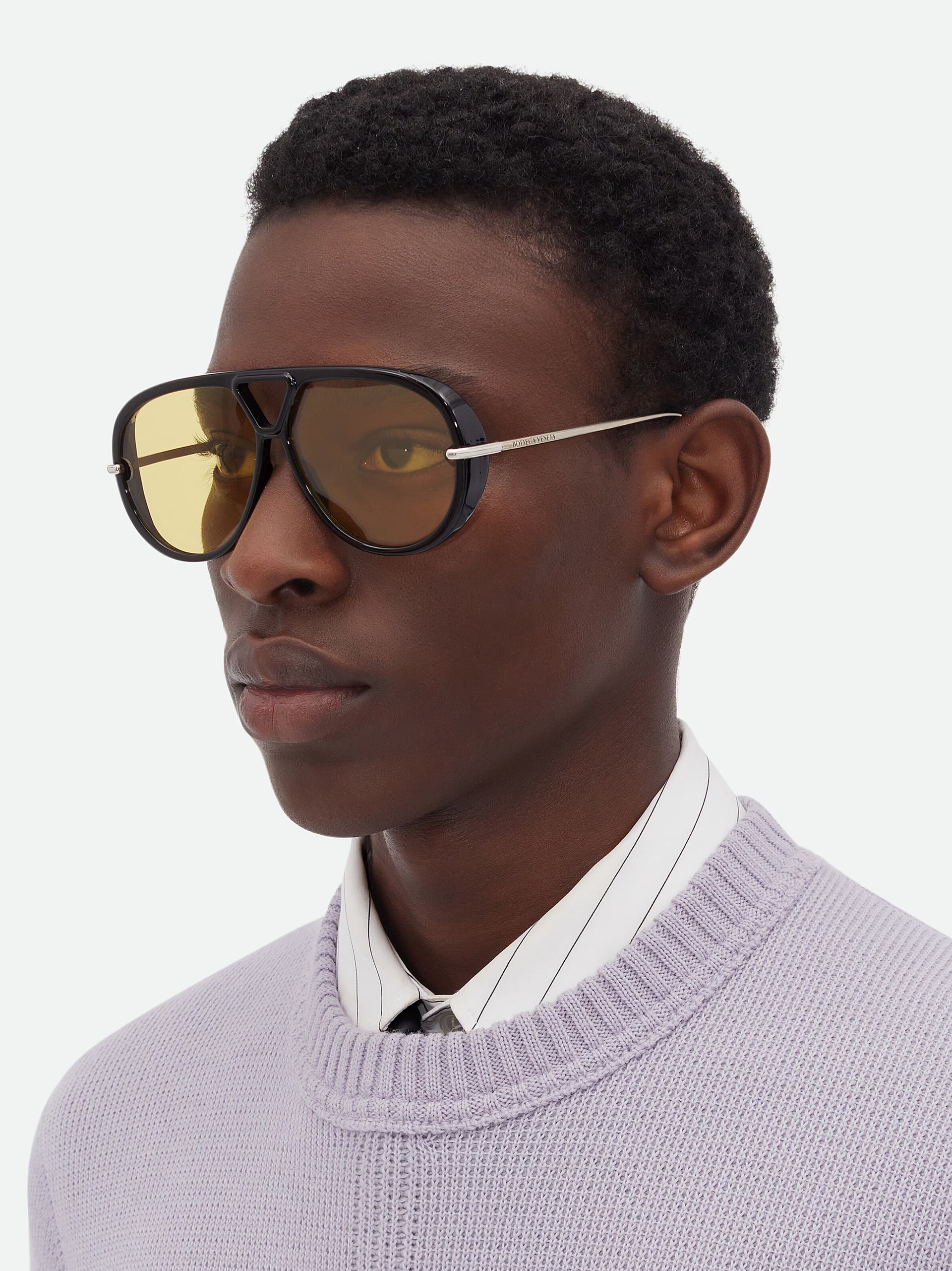 Bottega Veneta unisex black sunglasses with yellow lenses