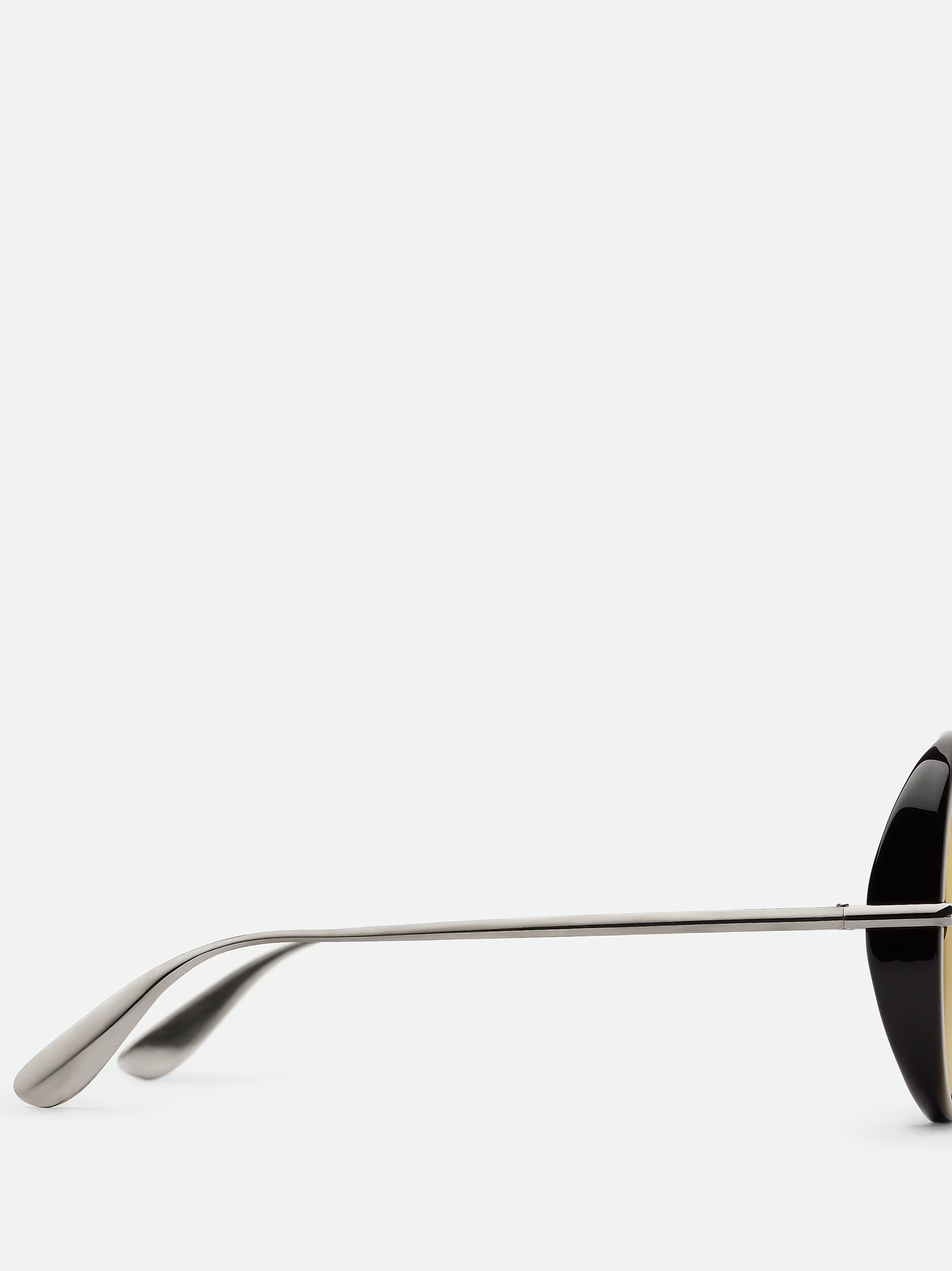 Bottega Veneta unisex black sunglasses with yellow lenses