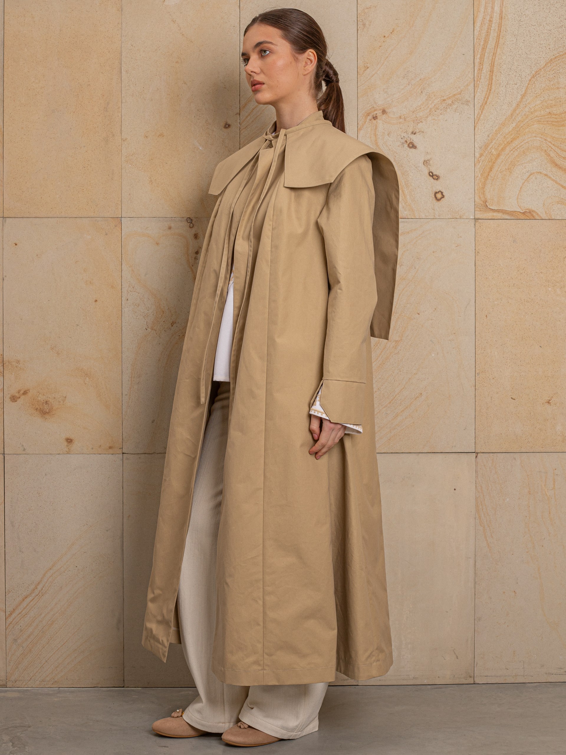 Park Avenue Atelier beige coat with embroidered back detail