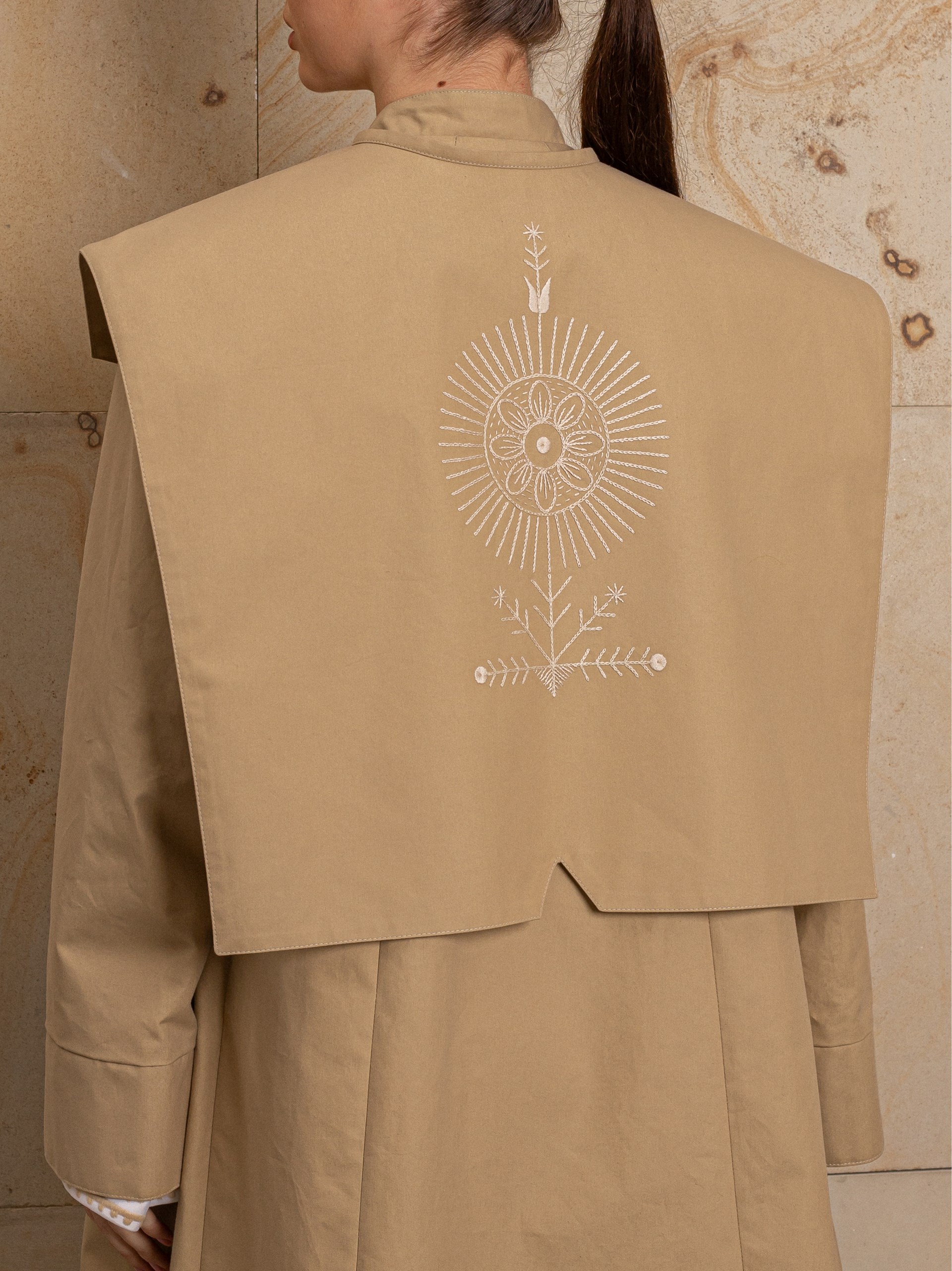 Park Avenue Atelier beige coat with embroidered back detail