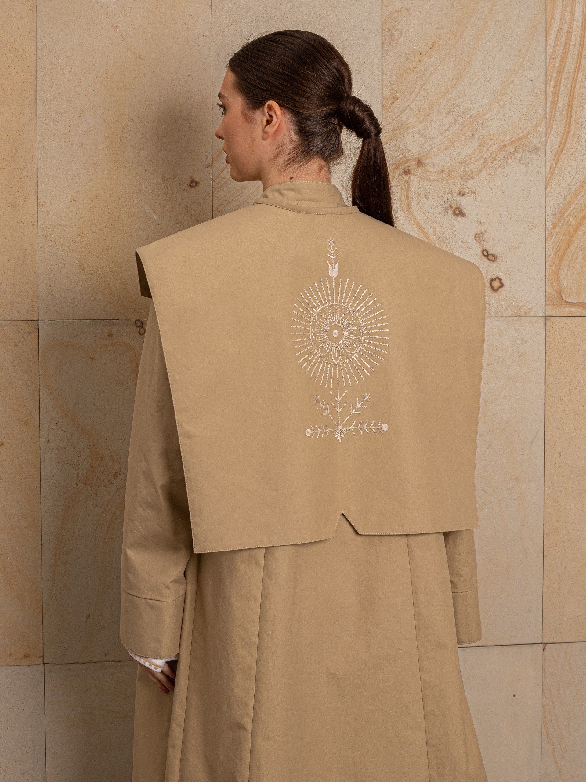 Park Avenue Atelier beige coat with embroidered back detail