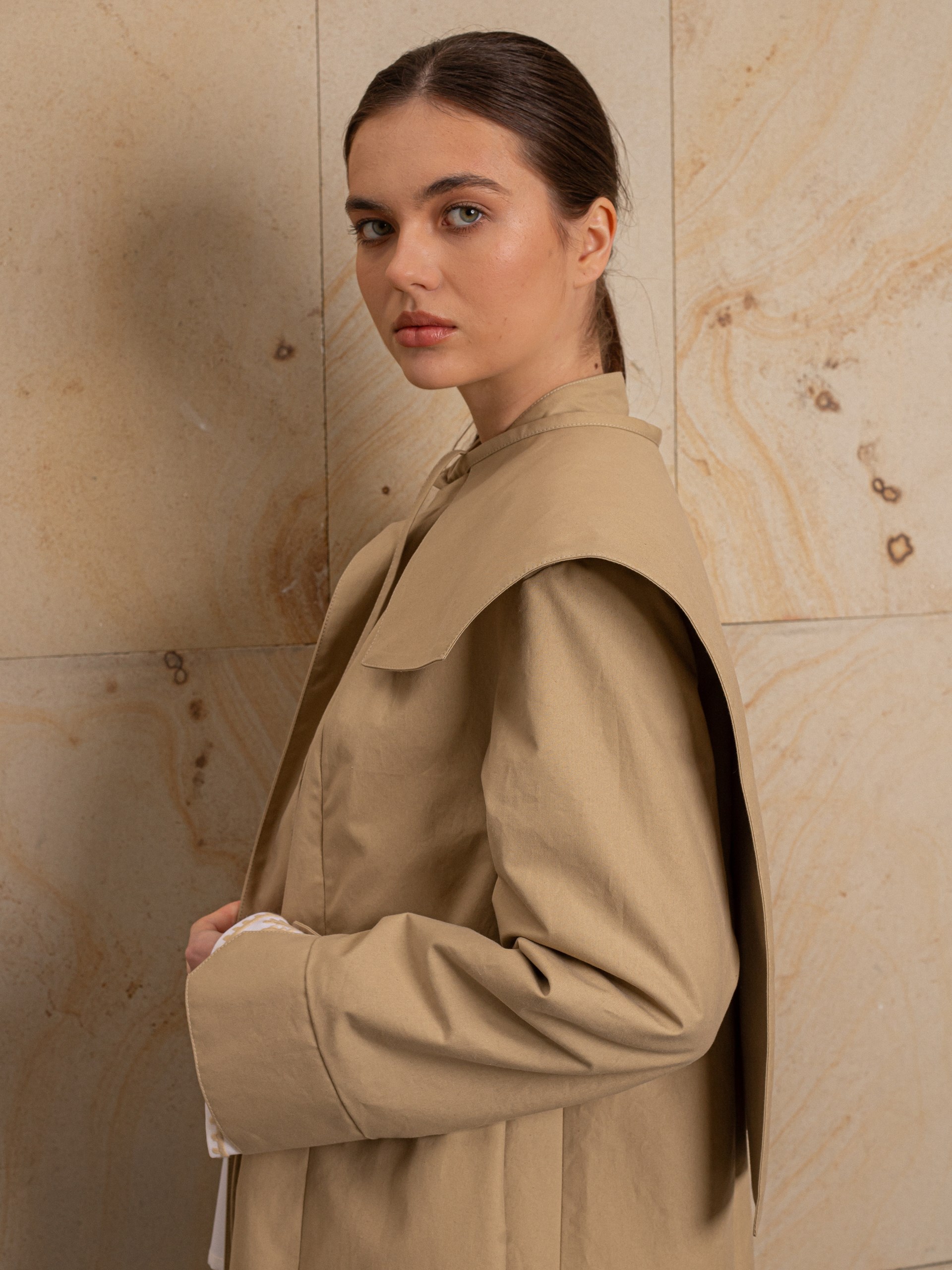 Park Avenue Atelier beige coat with embroidered back detail