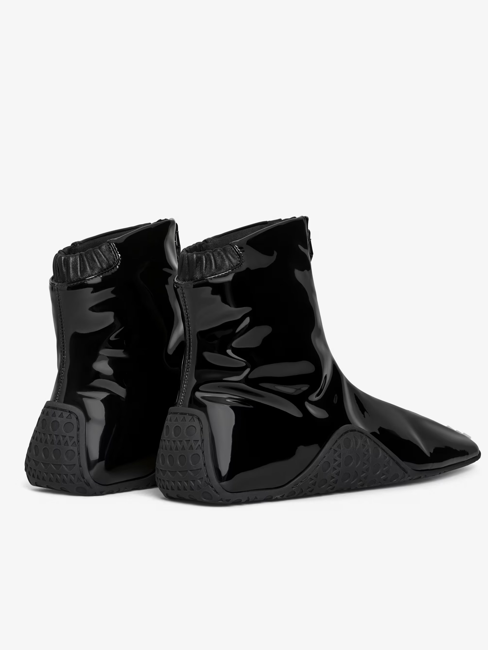 Black patent leather high-top sneakers by Alaia