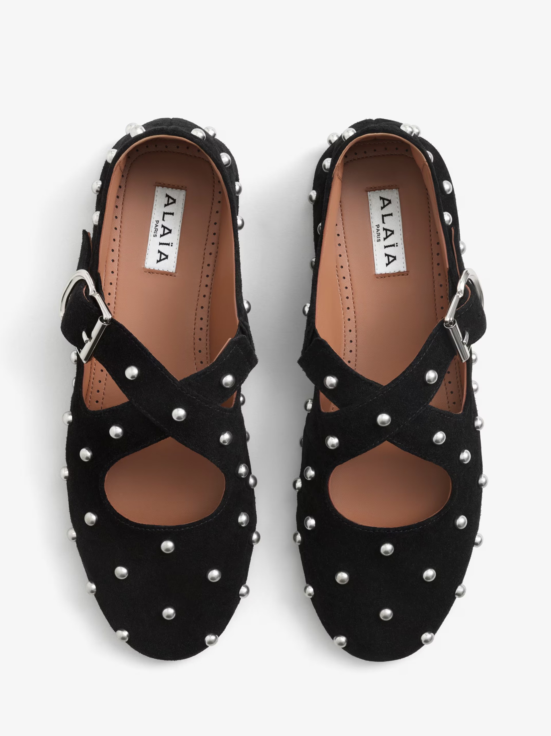 Black suede Alaia ballet flats with rhinestones