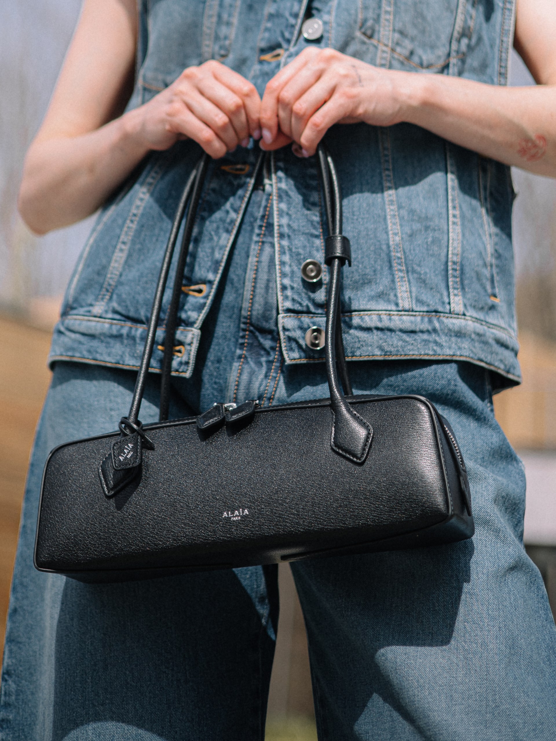 Alaia Le Teckel elongated black leather bag