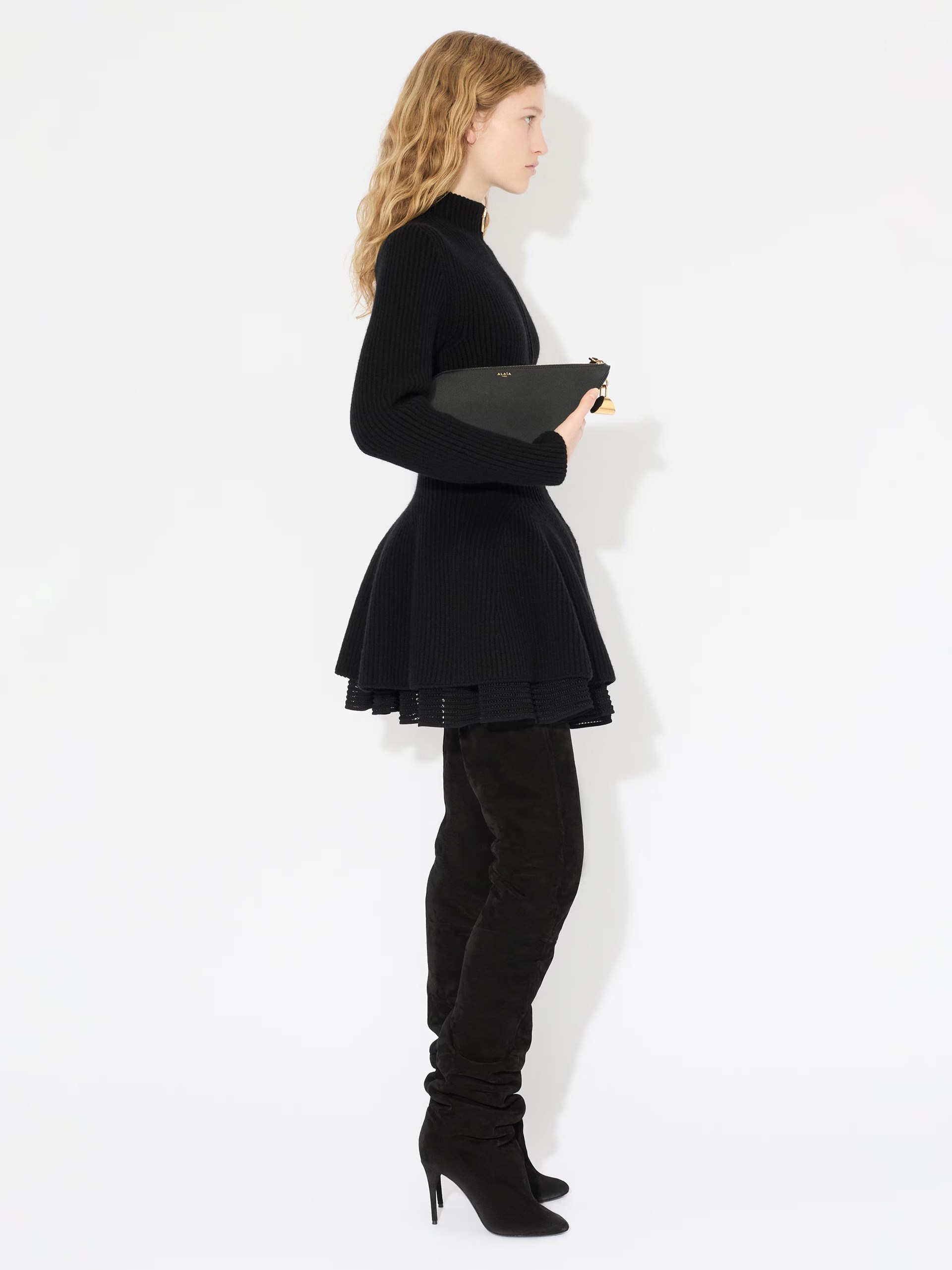 Black elongated cardigan in ribbed Alaia with zipper