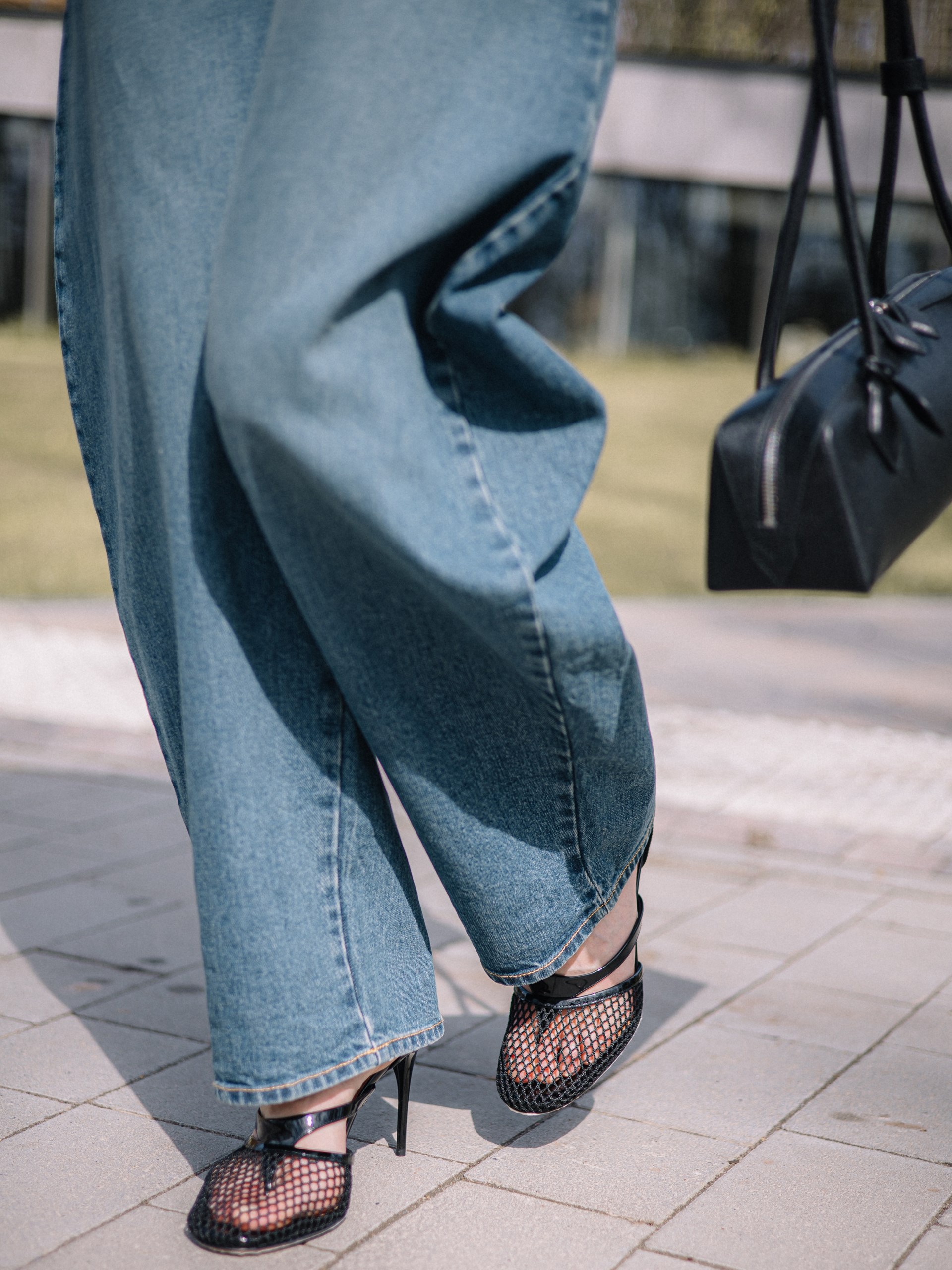 Black leather mesh heeled sandals by Alaia
