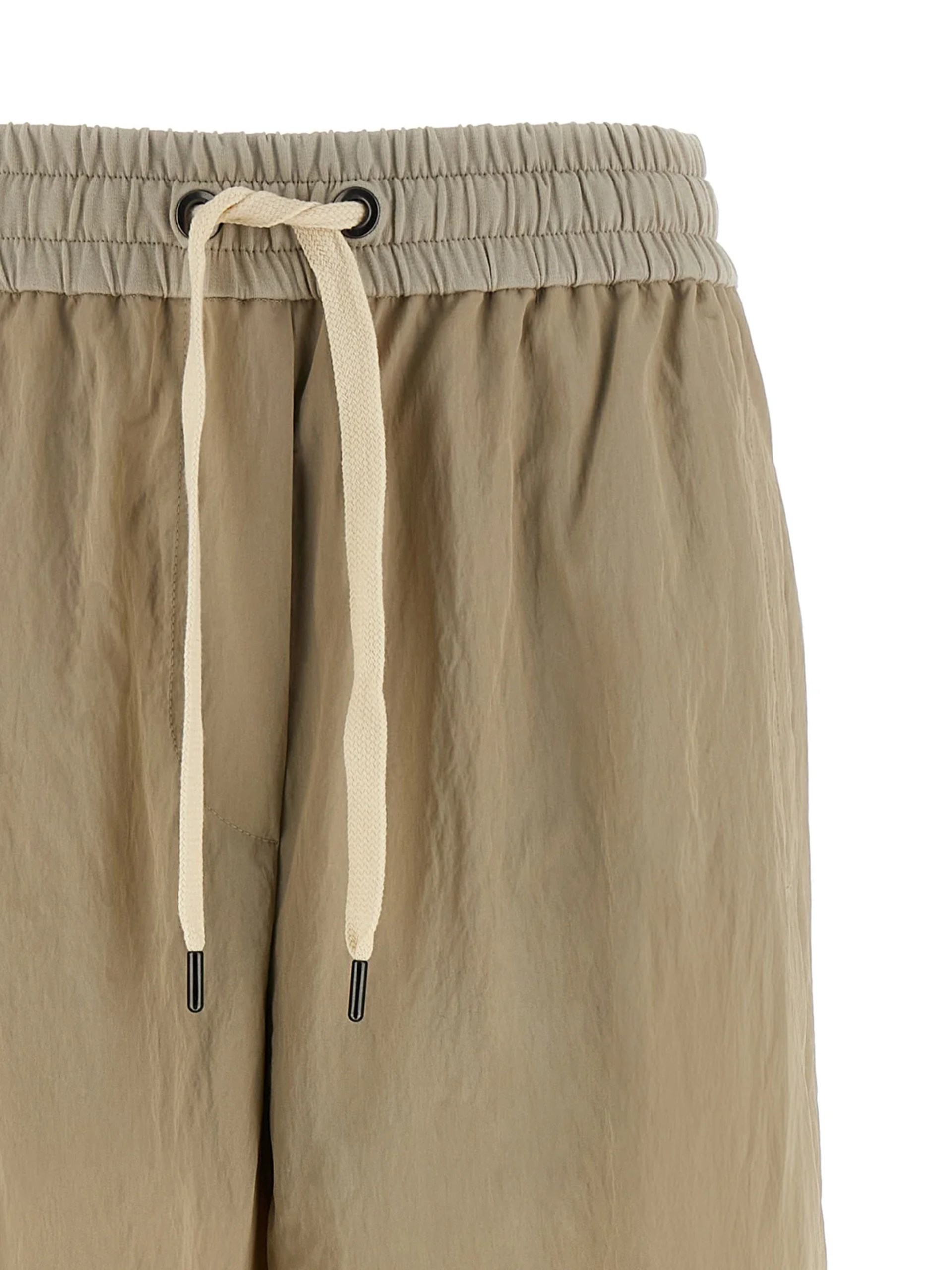 Brunello Cucinelli beige lace-up pants