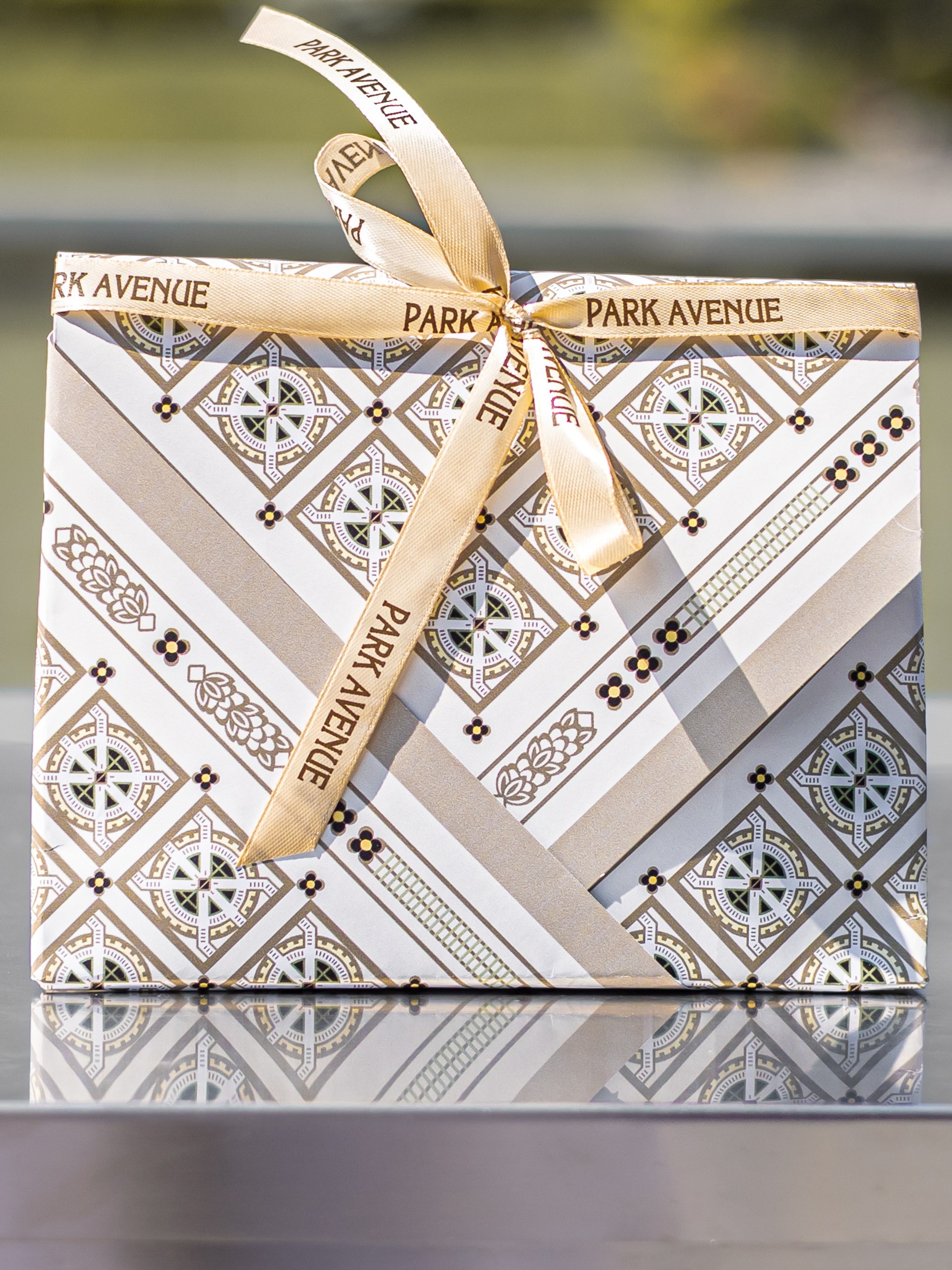 Beige Park Avenue Atelier scarf with an original graphic print